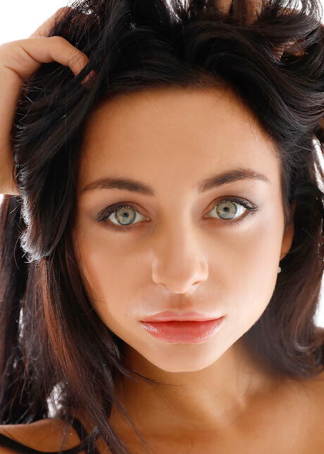 Hot dark-haired youthful Dominika Dark in sexy lingery uncovering small tits and pussy 